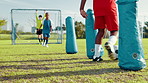 Boy, dribble and ball for soccer practice with inflatable, team training and fitness exercise. Children, equipment and drill  with net for sports workout, skills technique and agility for match game