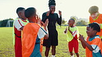 Soccer field, applause and coach with children for celebration, motivation and achievement for sports game. Excited, trainer and kids with fist pump for cheering, football winning or confidence boost