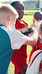 Hands together, soccer and teamwork with children on field for huddle, game plan and tournament strategy. Competition, training and practice with kids outdoor for sports, football player and support