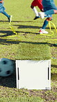 Drills, box and soccer ball with children on field for rebound pass, training practice and game. Sports, exercise and tournament with kids on outdoor pitch for football player, coaching and learning