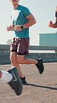 City, friends and legs for exercise, wellness challenge and training for marathon on bridge. Women, men and running people with endurance for fitness, cardio and morning jog on road with workout