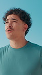 Fitness, man and tired with breathing outdoor for workout fatigue, running recovery and cardio burnout. Blue sky, athlete and resting for endurance challenge, marathon performance and exercise break