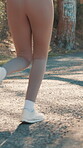 Running, legs and back of woman in nature for training, marathon practice and health Sports athlete, fitness and wellness with closeup of person on forest path for runner workout and exercise