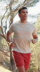 Running, fitness and sports with man in nature for training, marathon practice and health. Athlete, energy and wellness with person in forest for runner workout, challenge and exercise performance