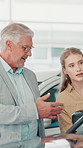 Car dealership, sales and man with customer talking for vehicle info, details and features. Transport, retail and person with woman on floor for conversation, discussion and decision for purchase