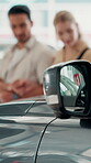 Choice, car and salesman with couple at dealership for test drive, auto showroom and vehicle decision. Seller, purchase and shopping with man and woman for rental agreement, insurance and customer