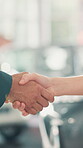 Keys, handshake and deal with people in car dealership for purchase success, salesman and vehicle shopping. Rental agreement, contract and shaking hands with closeup of customer in showroom for auto