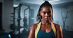 Fitness, bodybuilder and face of black woman in gym for body wellness, muscle or exercise. Portrait, health club or confident athlete, serious or determined for workout challenge or strength training