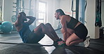 Fitness, class and man do sit up in gym for core workout, exercise and training for challenge. Health club, sports and person with personal trainer for muscle strength, wellness and performance