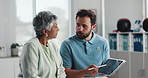 Physiotherapist, tablet and consultation with senior woman for health or recovery report. Technology, talking and chiropractor with patient for medical rehabilitation or treatment options in clinic