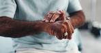 Hands, carpal tunnel and man in home with wrist pain, injury or accident with fibromyalgia. Closeup, arthritis and male person with inflammation for sprain muscle, sore or ache in living room.