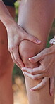Outdoor, runner and person with knee injury, accident or legs with joint pain, inflammation or ache. Swollen, athlete and muscle strain in nature, fitness and massage for tension, sore or broken bone
