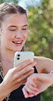 Fitness, girl and phone with smart watch outdoor for data sync, track workout and running speed. Athlete, happy and pair smartphone at park for cardio progress, performance metrics and exercise pace