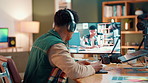 Man, influencer and headphones with laptop, screen and production for editing video or review. Monitor, tech and writing with content creation, audio and freelancer in house for social media podcast