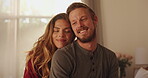 Home, calm and couple with smile in bedroom, romance and commitment to relationship, love and relax. Happy, man and bonding with woman on break, chilling and together with free time on bed in house