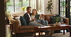 Couple, relax and talk with tablet at house for browsing website, watching movie and streaming film. People, coffee and digital for media research, surfing internet and multimedia for entertainment