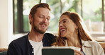 Laughing, tablet and couple on sofa in home for networking online together in living room. Happy, technology and man with woman for relax with connectivity on mobile app or social media in house.