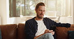 Relax, phone and man on sofa in home with networking, contact or social media scrolling. Notification, technology and male person with cellphone for connectivity, online or mobile app in living room.