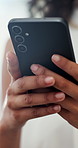 Phone, hands and businesswoman in office with communication, contact or networking online. Cellphone, closeup and female creative designer with email for client feedback on magazine publishing.