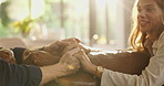 Happy couple, sofa and holding hands with empathy for trust, commitment or comfort together at home. Man, woman or support with touch, understanding or safety for sympathy, care or love at house