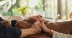 Couple, sofa or holding hands with sympathy for trust, commitment or comfort together at home. Closeup, man and woman in support with touch, understanding or safety for empathy, care or love at house