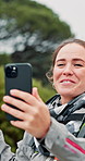 Video call, hiking and happy woman waving with phone in forest for adventure vlog. Mobile, trekking and person live streaming with greeting, travel or influencer talk to show nature on social media