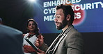Tablet, group and business people in discussion on a stage for enhanced cybersecurity measures. Meeting, digital technology and team of malware analysts with planning for website encryption system.