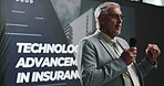 Presentation, speech and stage with business man in convention center for insurance technology. Conference, financial cover and surety with mature speaker on podium for advancement of wealth security