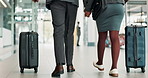 Business, luggage and couple holding hands at airport for global conference, working holiday or trip. Back, professional people and walking for international flight, travel support and opportunity