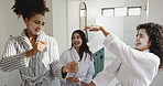 Happy women, friends and dancing in bathroom for spa day, energy or satisfaction together at resort. Excited, female people or group in joy with face mask for morning beauty treatment at luxury hotel