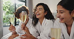 Friends, girls and relax with wine at spa for pamper date, bonding together or funny gossip. Holiday, people or laughing with alcohol in hotel room for weekend break, conversation joke or hospitality