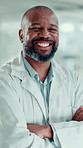 Scientist, black man and face with arms crossed in laboratory for healthcare, medical research and smile. Mature doctor, professional employee or confident portrait for pharmaceutical or study career