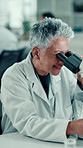Scientist, mature woman and microscope with smile for medical research, lab and pharma study. Person, zoom and vaccine development with sample, virus or bacteria with lens, equipment and analysis