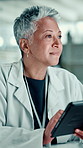 Medical research, scientist and mature woman with tablet, lab or browsing on website for healthcare. Clinic, neurologist and person with tech for analysis, smile and digital records for Alzheimer