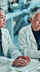 Discussion, typing and scientists in laboratory for research, discovery or project on DNA. Conversation, science and biologists working on medical RNA for pharmaceutical development in collaboration.