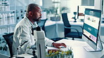 Black man, scientist and typing on computer in lab for medical research, experiment and botany. Person, online and pc for investigation report, genetic change and information of plants transformation