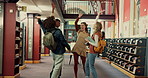 Cheering, students and group in library, celebration or gesture for achievement, happiness or proud. Success, learner and people with victory for education, university and teamwork for scholarship