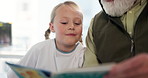 Hospital, child and grandfather with book for reading, storytelling and visit with support for girl. Healthcare, patient and senior person with novel for fantasy, development and wellness with kid