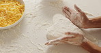 Dough, hands and person in kitchen for cooking with heart shape for pizza with ingredients for dinner. Top view, cheese and chef with culinary skills for preparing food with pastry on table in home.