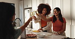 Cheers, wine and girl friends in kitchen with laughing, bonding or drinking alcohol together in home. Happy, cooking and group of women with sparkling beverage for preparing dinner in apartment.