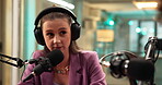 Radio, interview and woman with mic, talking and live streaming of audio communication or broadcast. Production, journalist and person with headphones for discussion, sound and digital conversation