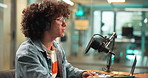 Laptop, headphones and man with microphone for recording, multimedia or radio DJ in studio. Audio equipment, computer and male person with podcast for online broadcast, announcement or live streaming