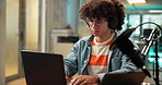 Laptop, headphones and man with microphone for broadcast, multimedia or radio DJ in studio. Audio equipment, computer and male person with recording for online podcast, announcement or live streaming