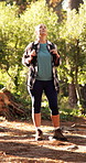 Hiking, travel and woman in woods for thinking, sightseeing and idea for adventure. Trekking, backpacking and person in forest for vacation, holiday and exploration with reflection for eco tourism