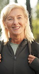 Hiking, face and senior woman in woods for travel, sightseeing and active retirement outdoor. Trekking, backpacking and portrait of happy person on vacation, holiday and eco tourism in forest in USA