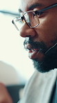 Business, call center and man with advice, talking and help desk with communication. African person, employee and conversation in office, customer service and support with corporate professional