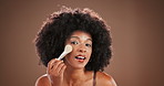 Face, foundation and makeup brush with black woman in studio for application of makeover cosmetics. Beauty, product and smile of happy model with tool for aesthetic, contouring or facial blending