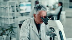 Studying, scientist and woman with microscope, lab and observing plant cells, analysis and research. Clinic, biologist and tech to identify cause of disease, medical professional and mature person