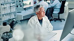Computer, science and woman in lab, research or online reading for test results, choice or internet. Mature person, employee and scientist in workplace, pc and solution with biotech and experiment