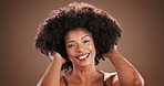 Face, afro and happy black woman with hair care for beauty, natural texture and growth. Portrait, model and hairstyle for cosmetics, hairdresser or salon treatment for volume on studio background